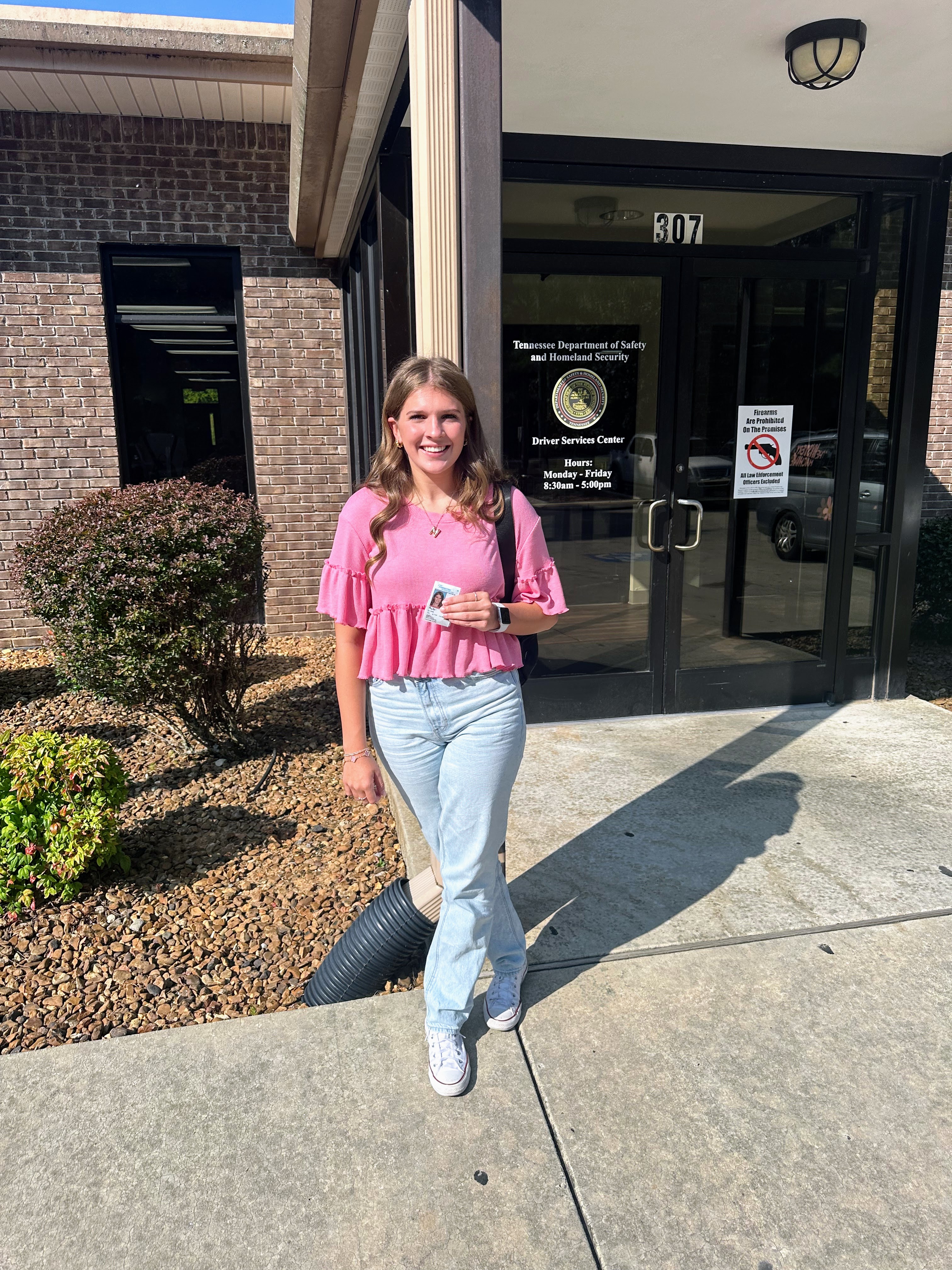 MJ at the DMV after passing her driver's test.